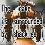 The cake is surrounded by shackles